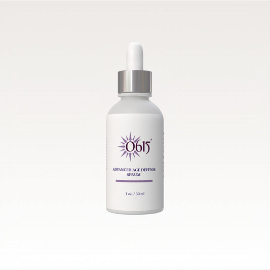 White serum bottle with silver cap on a light gray background