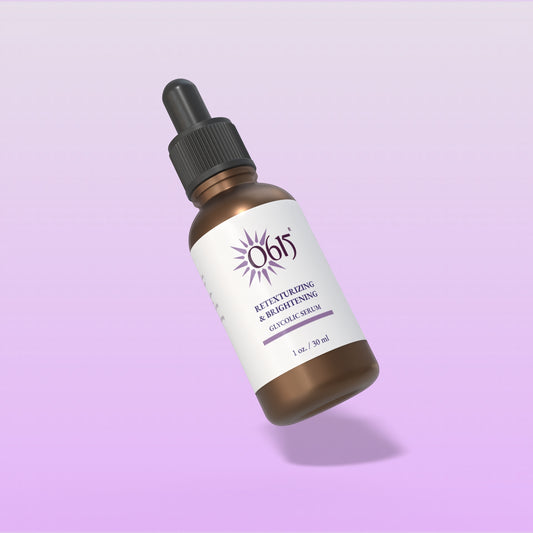 Brown serum bottle with dropper on a light purple background