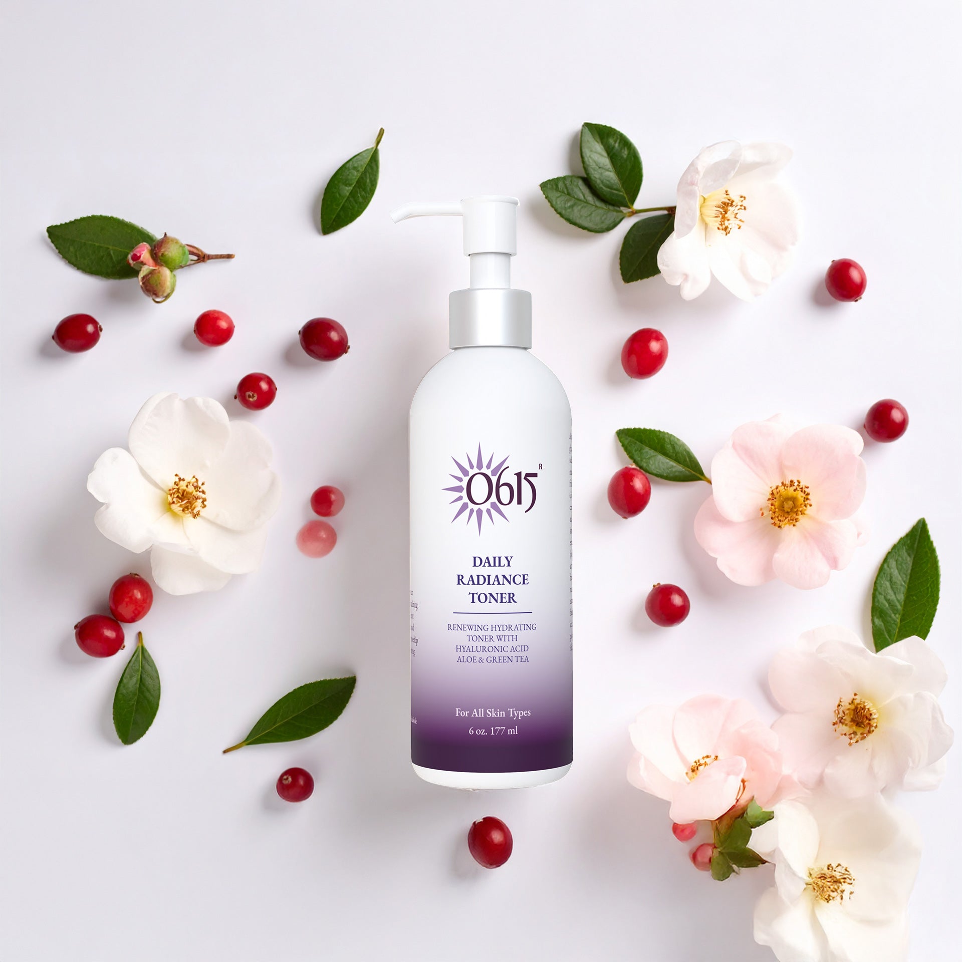 Daily Radiance Toner bottle surrounded by flowers and berries on a light background