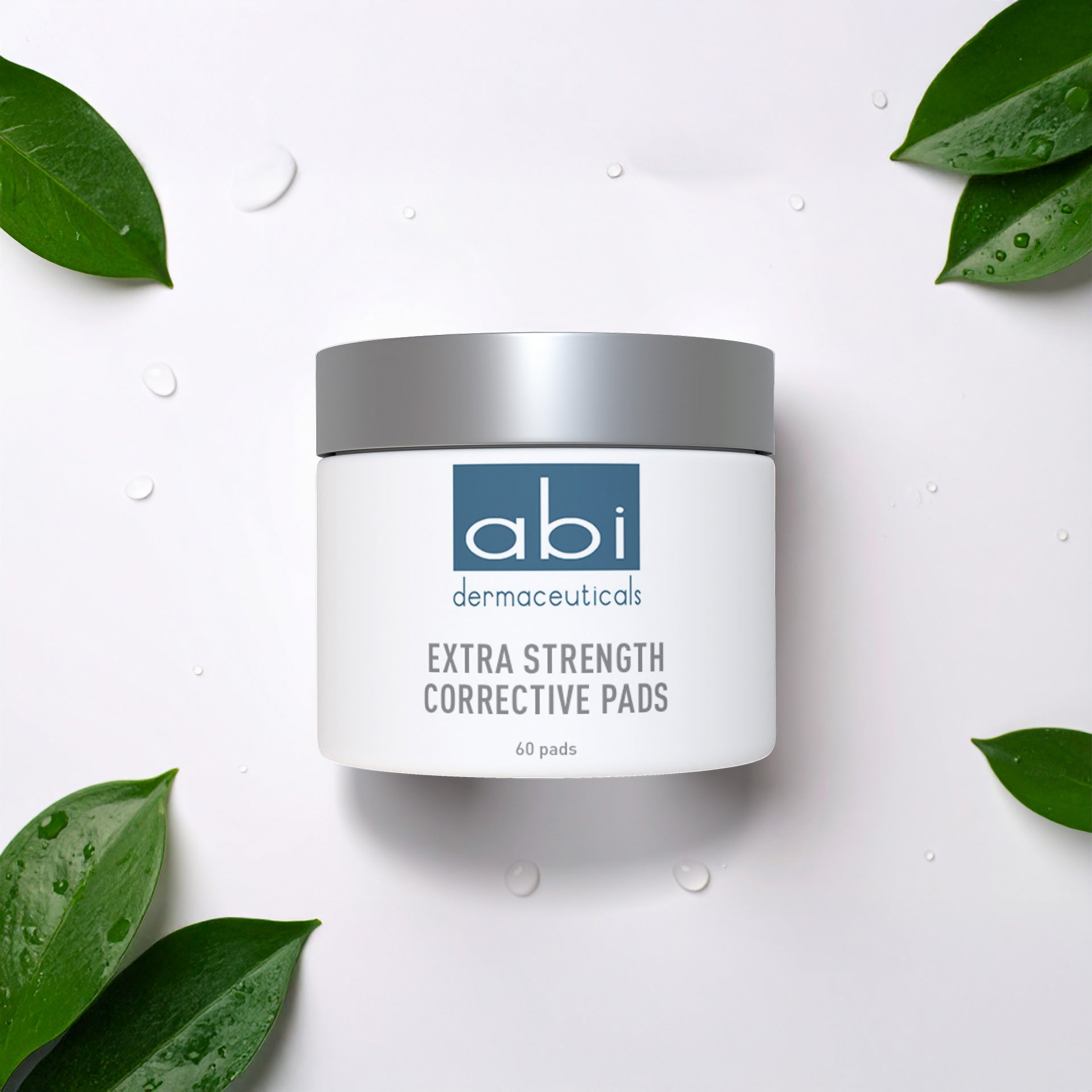 abi dermaeuticals Extra Strength Corrective Pads container on a white background with green leaves.