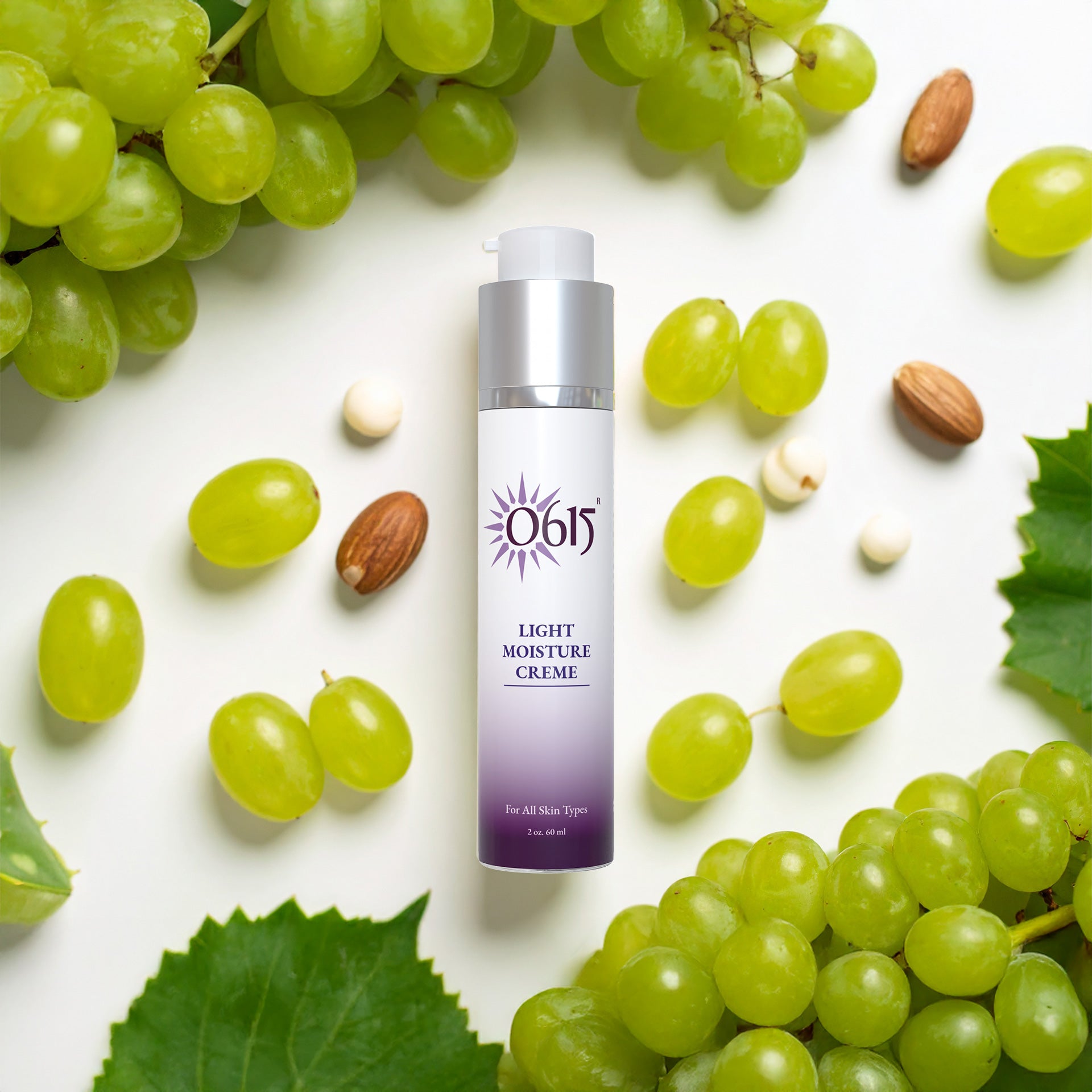 Light Moisture Creme bottle surrounded by green grapes and almonds on a white background