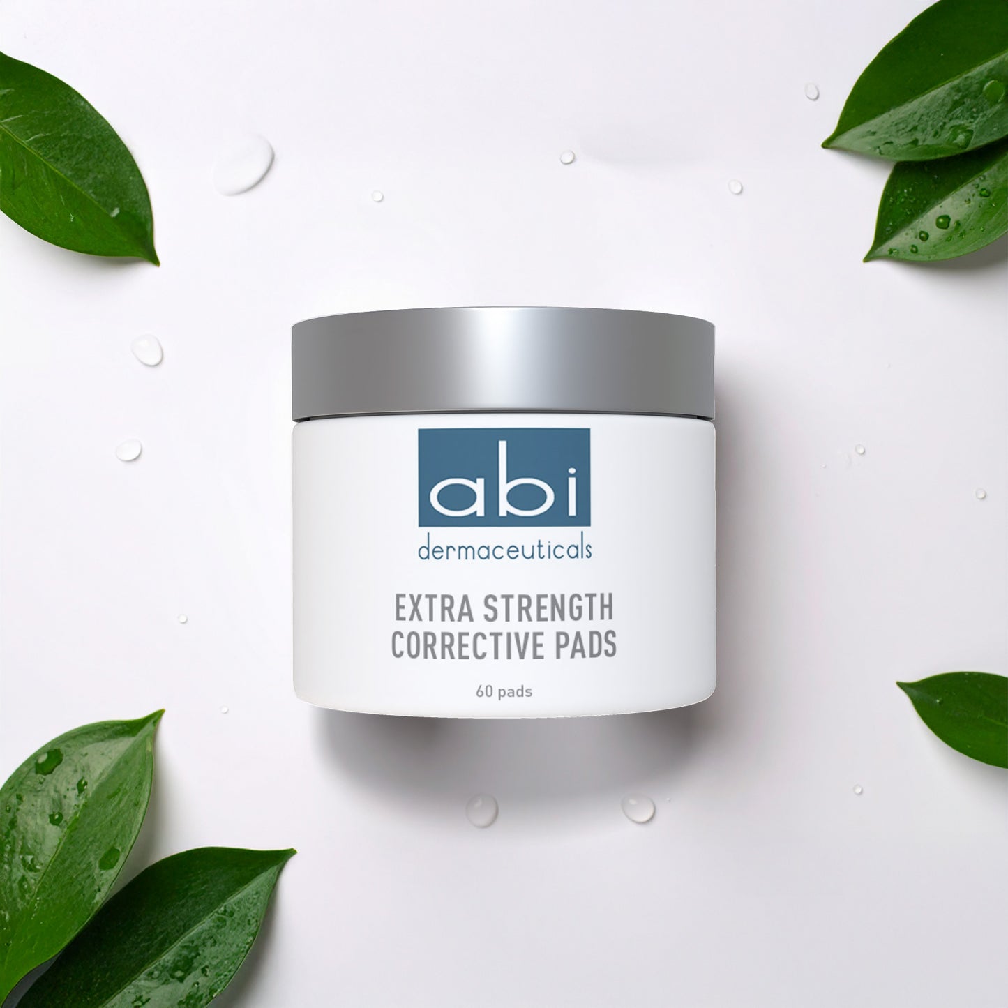  abi dermaeuticals Extra Strength Corrective Pads container on a white background with green leaves.